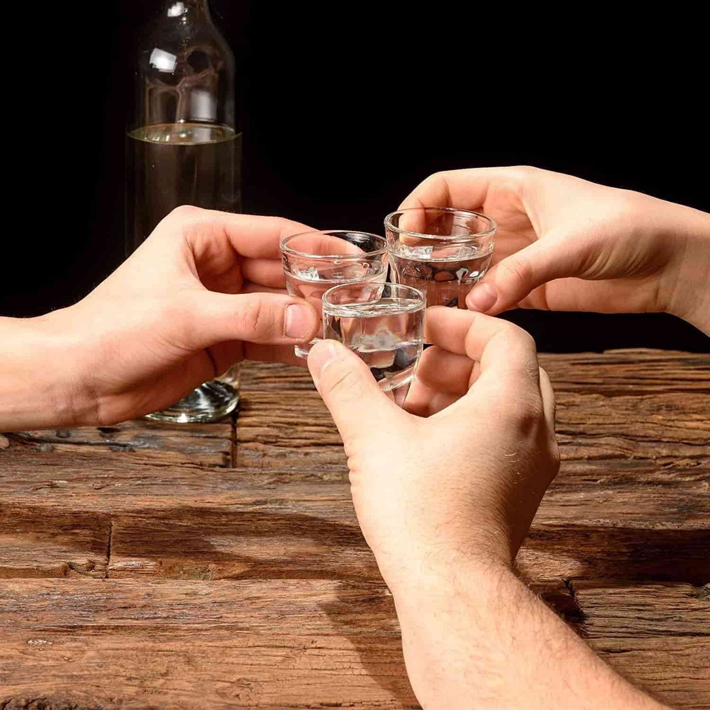 Shot Glasses in hand