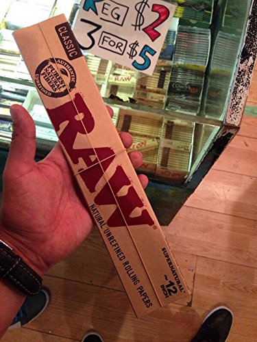 raw 12 inch rolling paper in hand