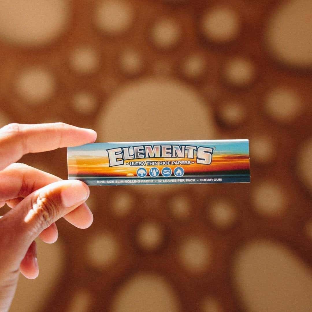 Elements Ultra Thin Rice King Size Rolling Paper in hand